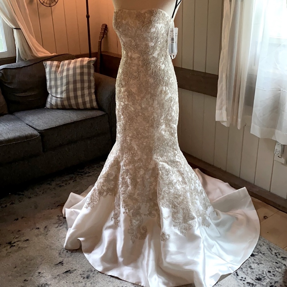 Brand new with tags Oleg Cassini wedding dress.